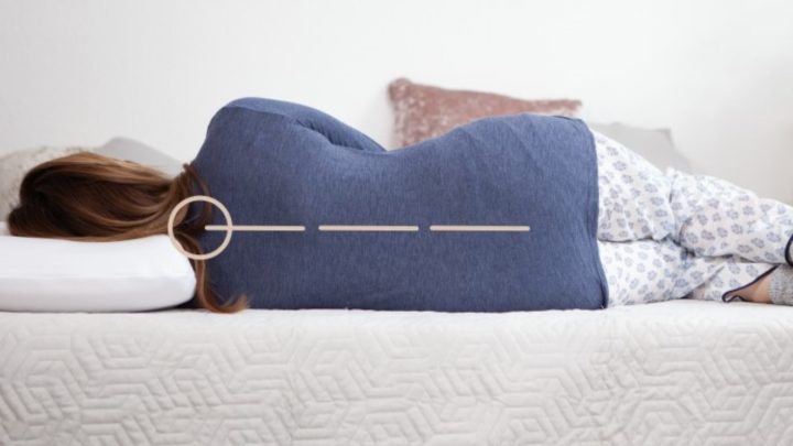 woman sleeping on a mattress in spinal alignment