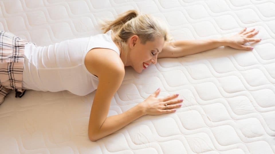 woman lying face down on an orthopedic mattress