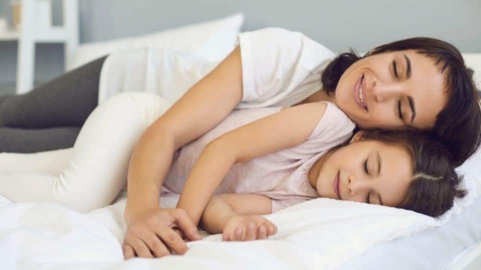 woman and child sleeping on an orthopedic mattress